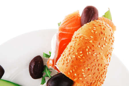 salmon sandwich and olives on green dishの写真素材