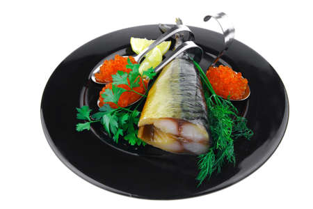 smoked fish with red caviar on black plateの写真素材
