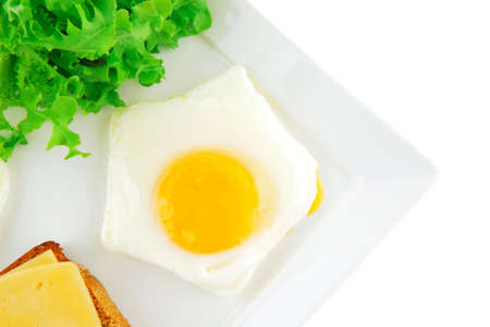 eggs,cheese, salad, and bread on white plateの写真素材