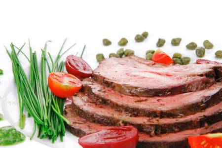 beef barbecue served on big white dishの写真素材