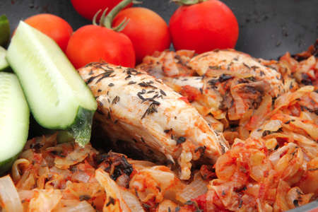 meat grilled chicken fillet cooked with vegetables on ceramic pan isolated over white backgroundの写真素材