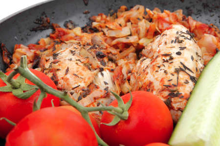 meat grilled chicken fillet cooked with vegetables on ceramic pan isolated over white backgroundの写真素材