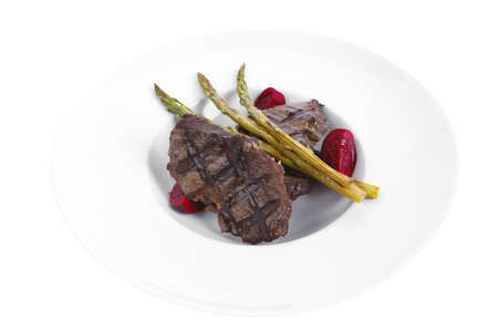 grilled red beef pork meat barbecue steak fillet with asparagus and hot pepper served on deep plate isolated on white backgroundの写真素材