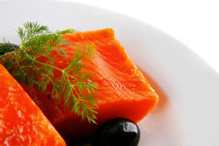 smoked fresh salmon piece with olives and fennel