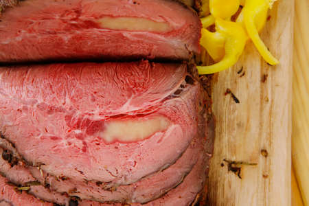 beef barbecue served on big wooden plateの写真素材