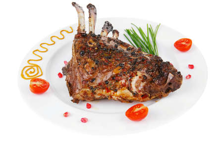 served grilled ribs rack over white plateの写真素材