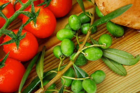 fresh prepared raw vegetables on cutting boardの写真素材