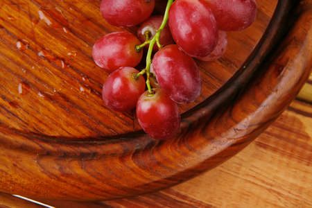 fresh raw red grape on wooden table