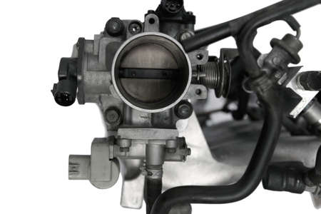 real used car motor engine part isolated on white background