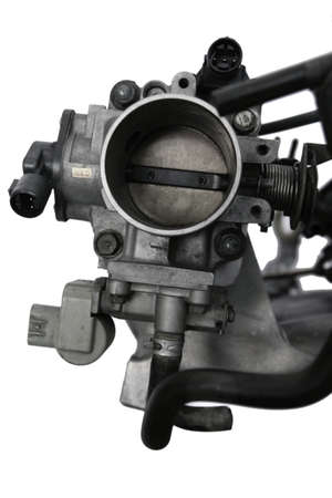 real used car motor engine part isolated on white background