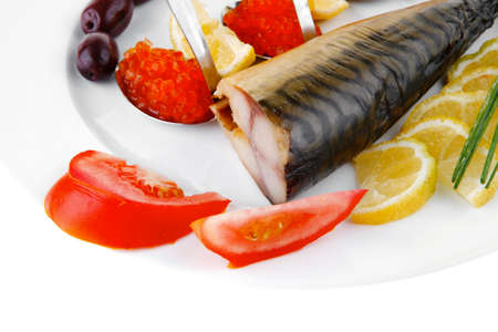 diet food - red caviar and smoked mackerel fish with lemon tomatoes and bread on white china plate...