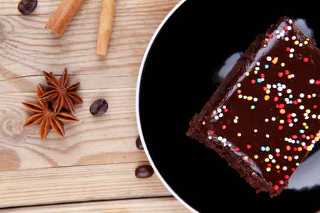 dessert : hot black coffee and chocolate cake with cinnamon , coffee beans, and anise star