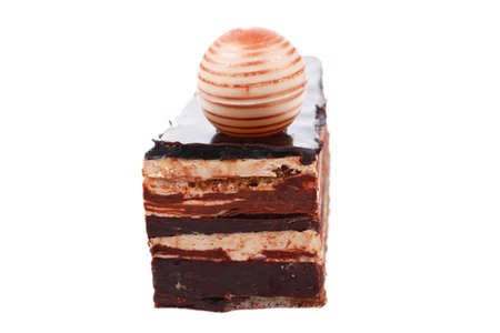 single chocolate cake with sphere isolated over white backgroundの写真素材