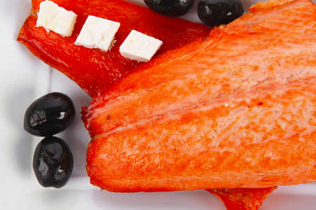 fresh grilled salmon meat fillet with goat light greek feta cheese black olives and tomatoes over...