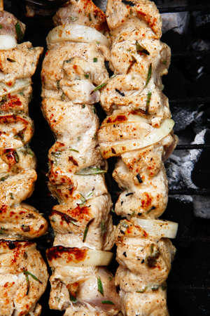 healthy shish kebab - ready grill barbecue chicken turkish meat on skewers over charcoal brazier outdoorの写真素材