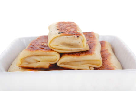 russian food - pancake with various fillings served in white bowl isolated over white backgroundの写真素材