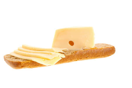 yellow fromage french cheese bar and slice on rye bread isolated over white backgroundの写真素材