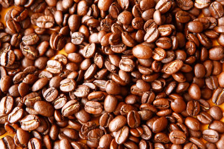 dark roasted ready fresh coffee beans in bulk isolated over white background