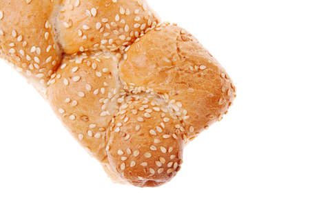 fresh loaf of light wheat bread topped by sesame seeds isolated over white backgroundの写真素材