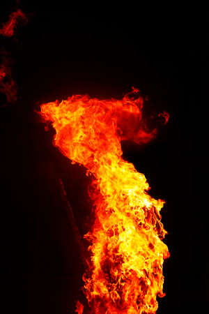 red fire tongue on black backgroundの写真素材