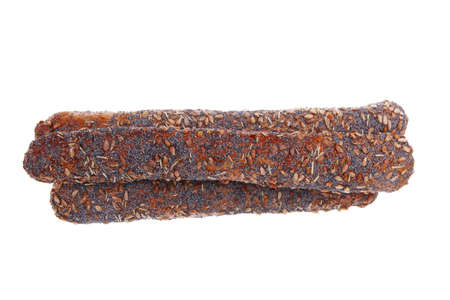 big french rye bread baguette topped with sunflower and poppy seeds isolated over white backgroundの写真素材