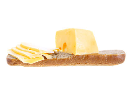 yellow fromage french cheese bar and slice on rye bread isolated over white backgroundの写真素材