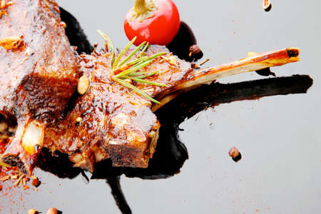 served savory plate: meat ribs with spices and red hot pepper . shallow dofの写真素材