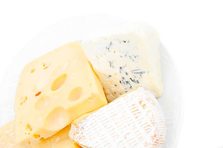 solid french cheese parmesan brie and edam on white platter isolated on white background