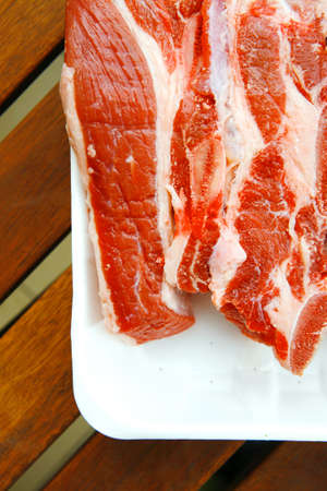 image of raw ribs on wooden table
