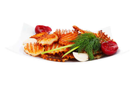 potato chips served with small pickled eggplants on small white plate isolated on white backgroundの写真素材