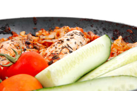 meat grilled chicken fillet cooked with vegetables on ceramic pan isolated over white backgroundの写真素材