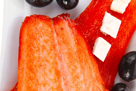 fresh grilled salmon meat fillet with goat light greek feta cheese black olives and tomatoes over...