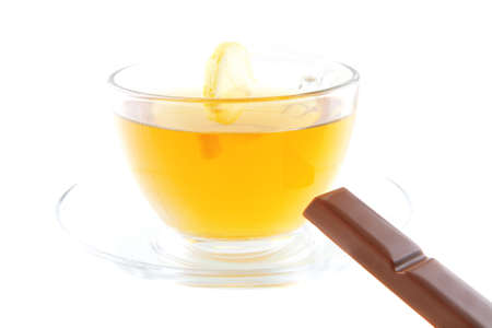 black tea and chocolate bar on whiteの写真素材