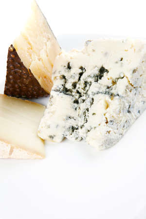set of french aged cheeses on a white ceramic plate