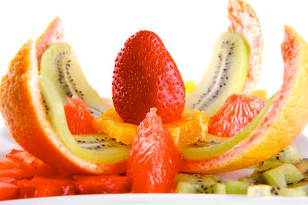 served fresh raw tropical fruits on plateの写真素材