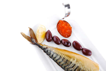 smoked fish served on plate with red caviarの写真素材