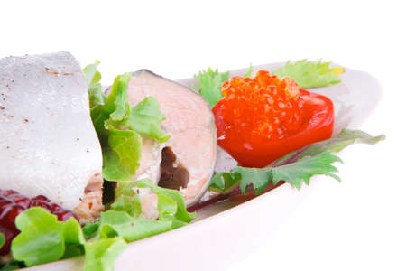 served salmon with caviar on plate over whiteの写真素材