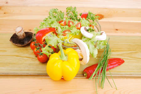 vegetables in salad on woodの写真素材
