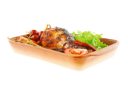 roasted chicken legs and peppers with lettuceの写真素材