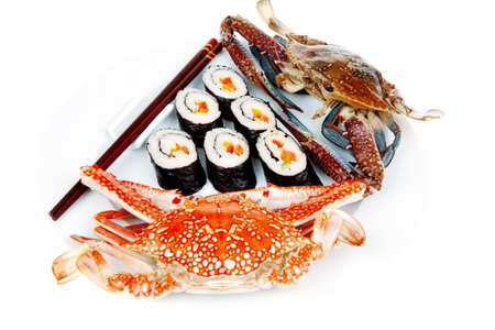 Japanese Cuisine : Sushi Maki Roll with Vegetables and Salmon inside . on black dish with red and blue crabs .の写真素材