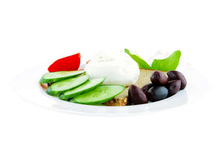 light mozzarella and bread with vegetables on plateの写真素材