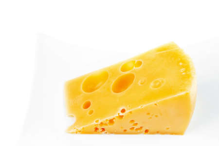 french gourmet parmesan cheese  on china plate isolated over white backgroundの写真素材