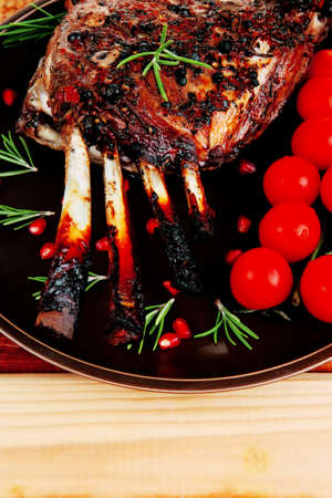 served charbroiled ribs on plate over woodの写真素材