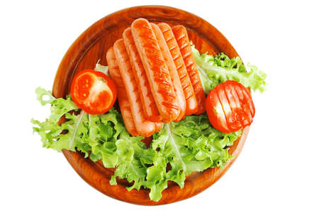 grilled pyramid of beef sausages on wooden plateの写真素材