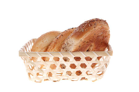 three different bagels in basket isolated over white backgroundの写真素材