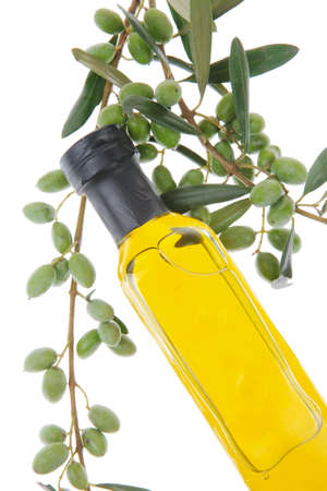 green olives with gold oil over whiteの写真素材