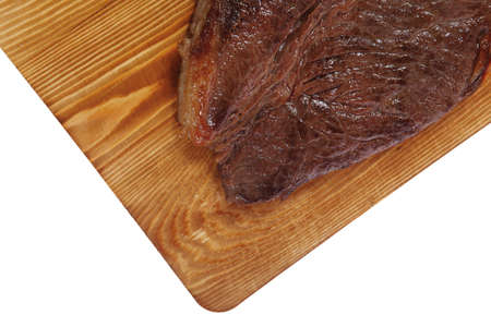 roast beefsteak fillet on wood isolated over white backgroundの写真素材