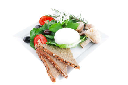 light white feta cheese and green lettuce on whiteの写真素材