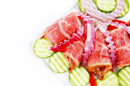 fresh roasted meat rolls on white platterの写真素材