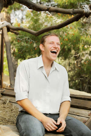 young happy white caucasion man taste and enjoy red wine outdoor in in countryside . classic style...